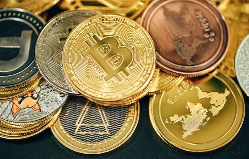 Cryptocurrency Types - a pile of gold and silver bitcoins