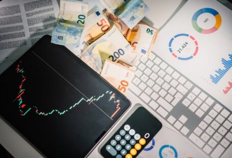 stock-charts-on-tablet-screen-business-and-economy